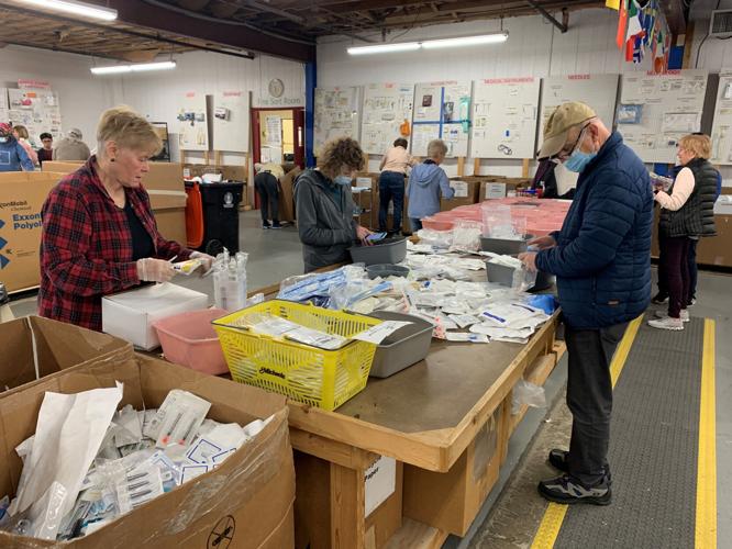 Volunteers at Louisville-based SOS assemble medical kits bound for Ukraine