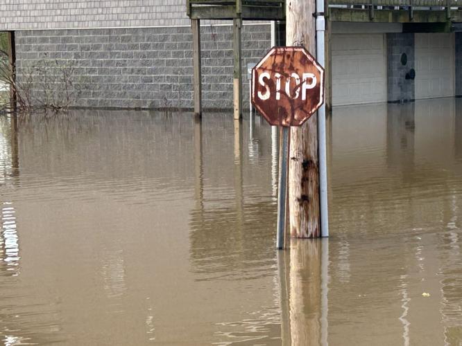 Utica floodwater near stop sign