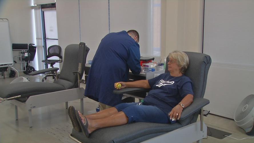 Woman giving blood at WDRB blood drive