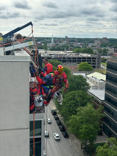 Window washers rappel from Norton Children's Hospital dressed as superheroes