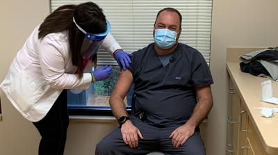 Dr. Eric Yazel getting COVID-19 vaccine