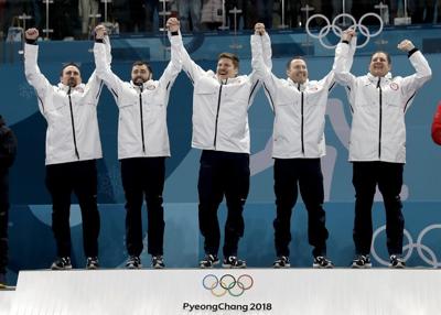 United States curlers after winning olympic gold - AP FILE.jpeg