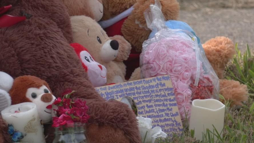 Balloons and teddy bears at vigil.