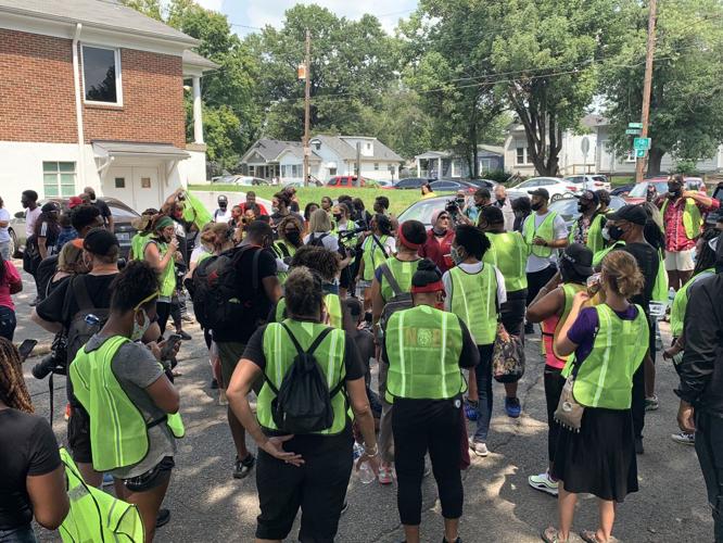 Until Freedom protesters in green vests.jpg