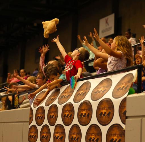 Child catches bear at Bed Races.JPG