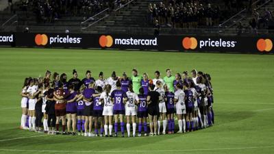 NWSL players huddle