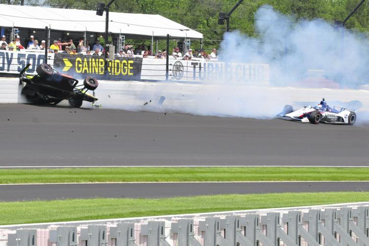 Sebastien Bourdais hits the wall in the third turn