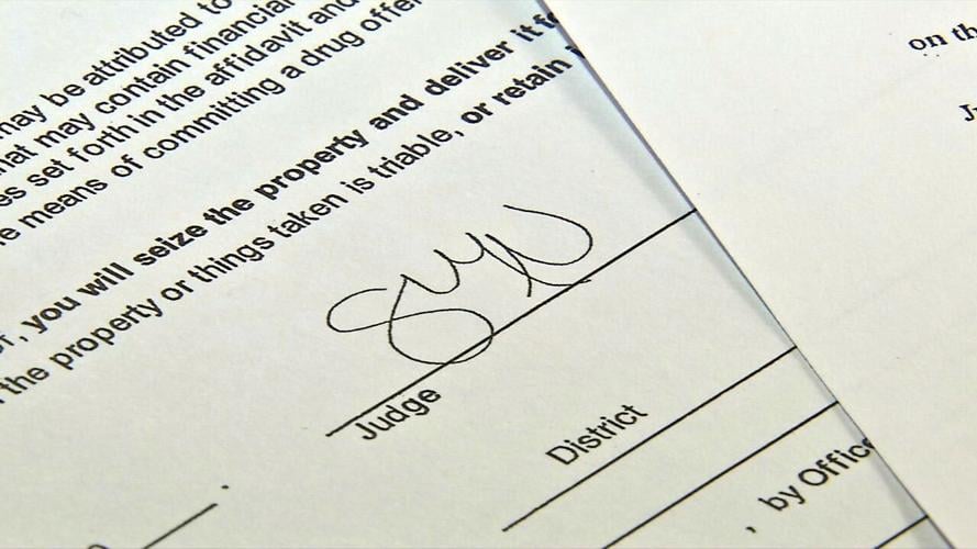 warrants signature credit Zach Crabtree WDRB.jpeg