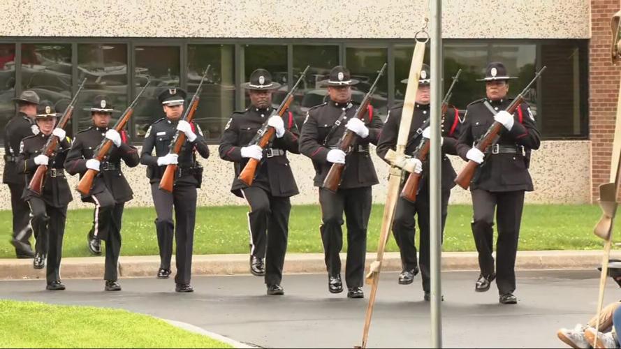 Police officers march at ceremony to honor fallen colleagues
