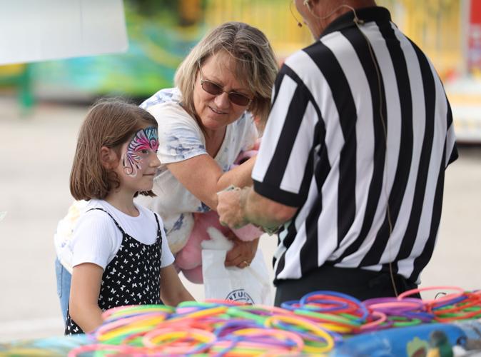 Girl plays game at the Midway