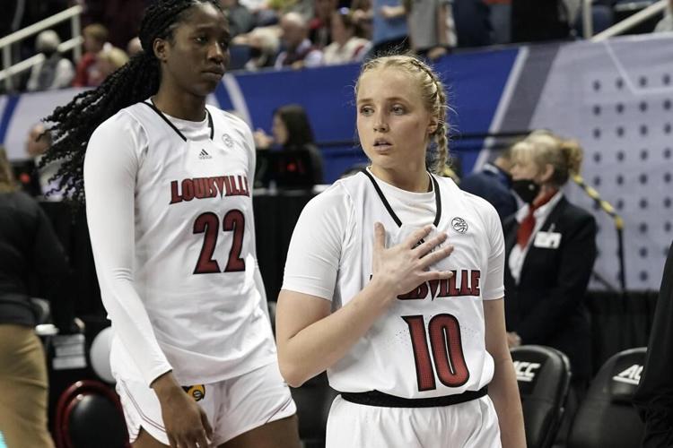 Louisville forward Liz Dixon and guard Hailey Van Lith leave the court.jpeg
