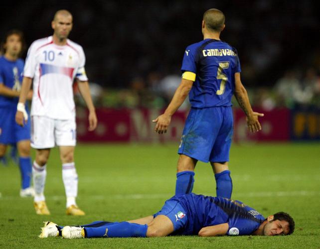 France's Zinedine Zidane, left, looks on after head butting Italy's Marco Materazzi