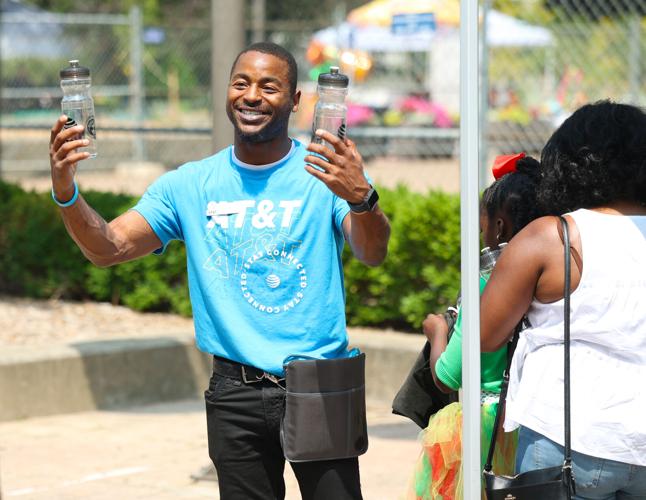 ATT passes out water bottles at Juneteenth.JPG