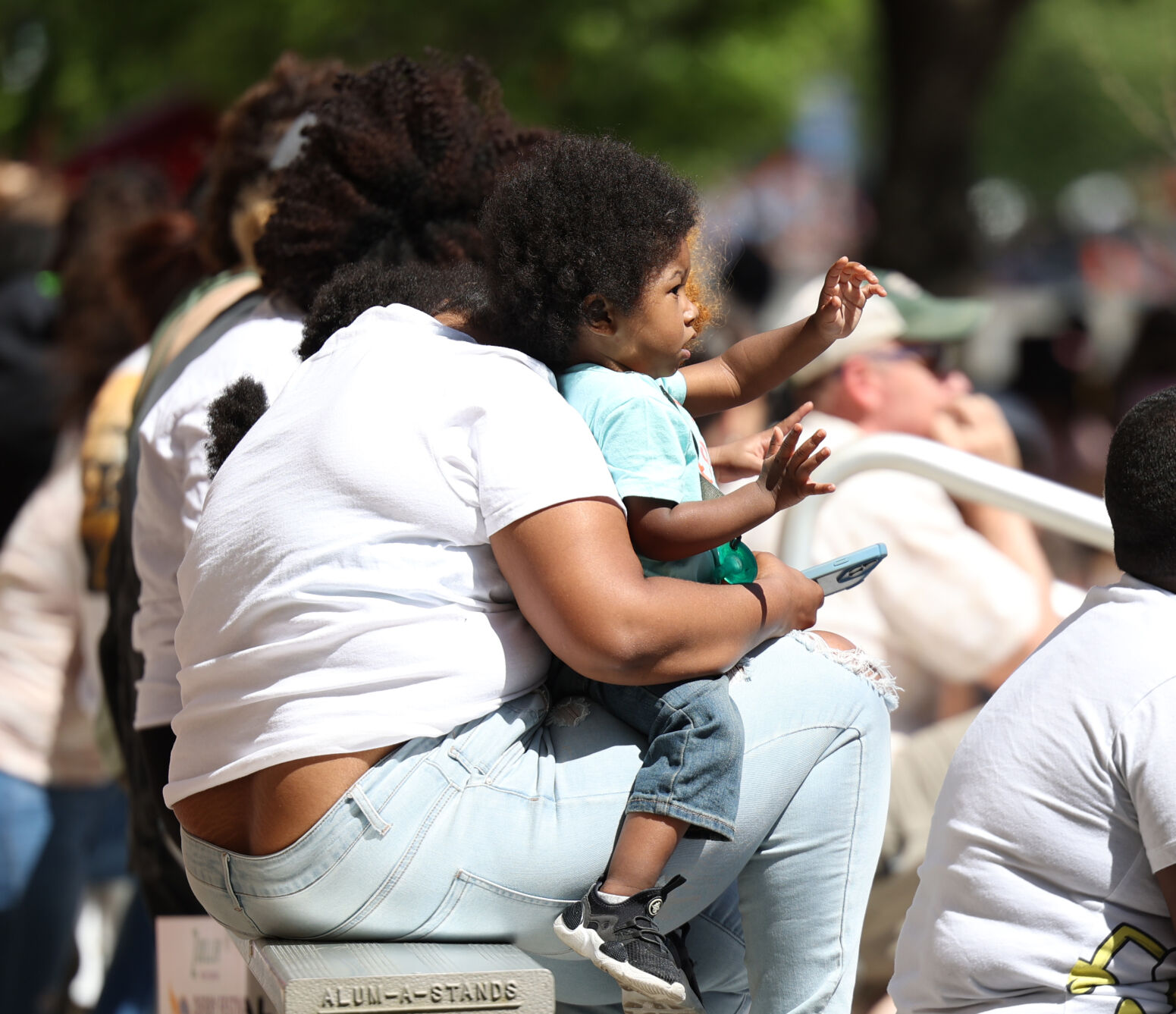 Baby waves during Pegasus Parade