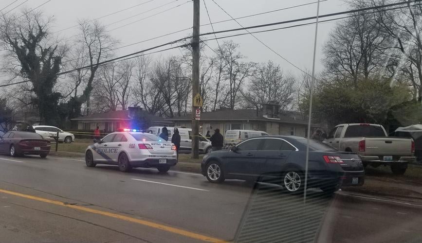 Police activity outside home on Cane Run Road, near Kristin Way, on Dec. 16, 2020