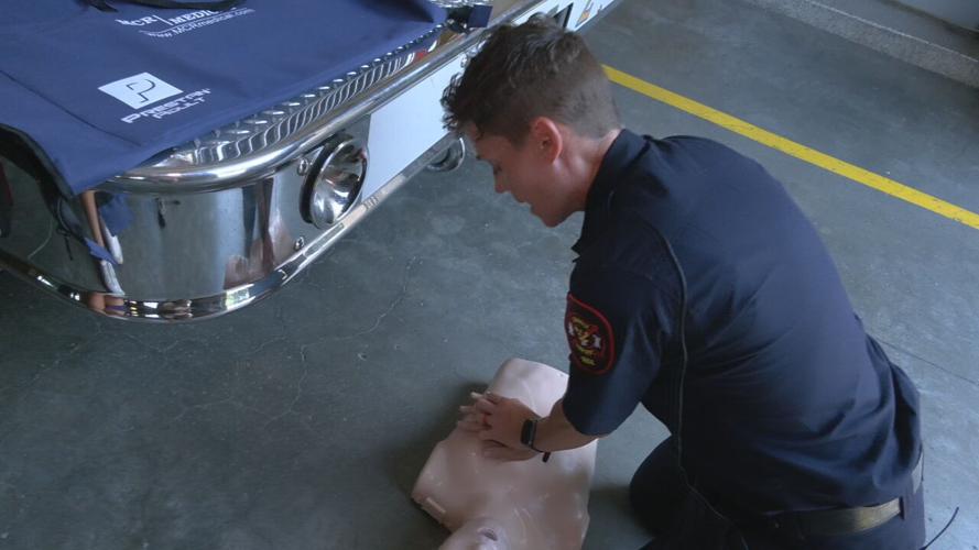 Louisville firefighter demonstrates Hands Only CPR technique