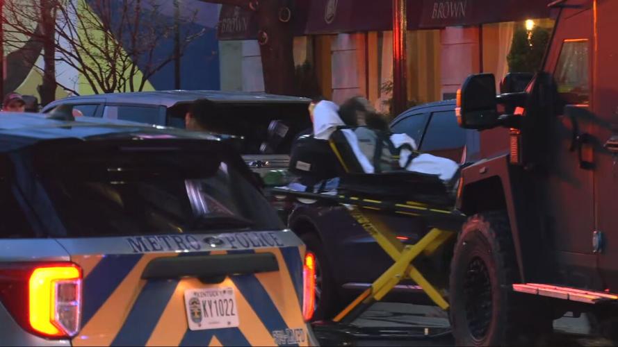 Man on stretcher outside Brown Hotel in Louisville