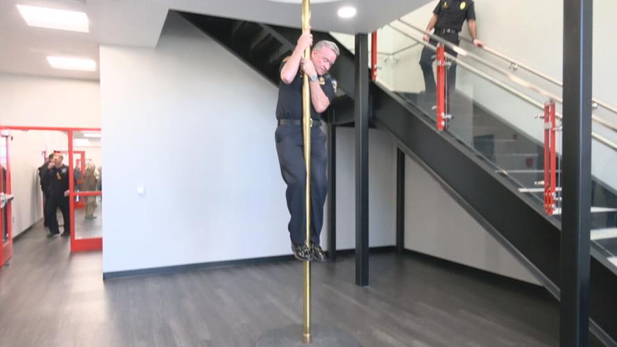 Jeffersontown firefighter tests pole at Fire Station No. 54