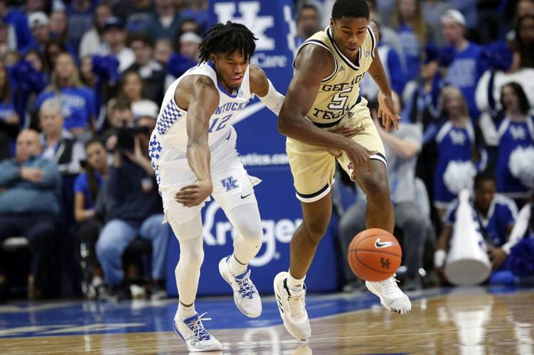 Kentucky's Keion Brooks Jr., left, and Georgia Tech's Moses Wright go after a loose ball