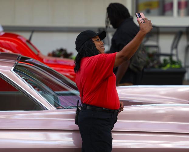 Woman takes selfie with Street Rods.JPG