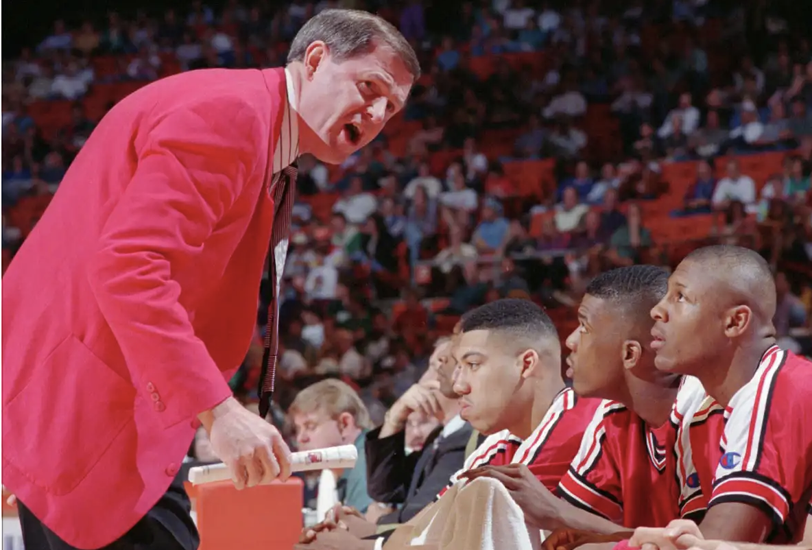 Former U of L coach Denny Crum shows off his sports collection