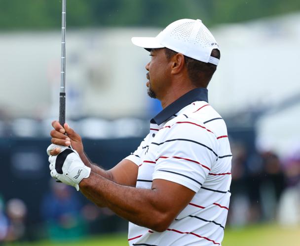 Tiger Woods hits iron at practice range at Valhalla.JPG