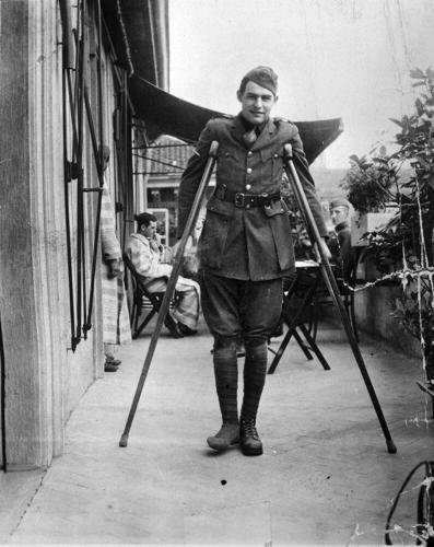 Ernest Hemingway on crutches in Milan, Italy in 1918.jpeg