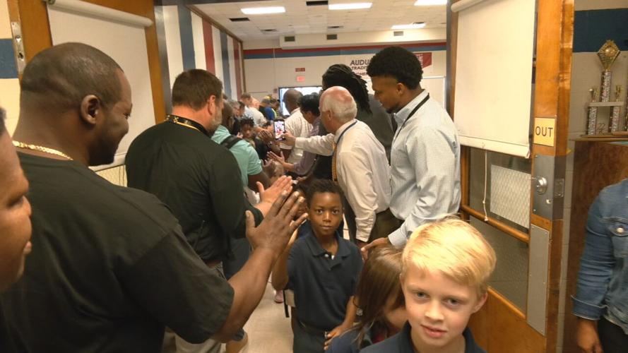 'Flash dads' greet JCPS students before classes at Audubon Elementary School