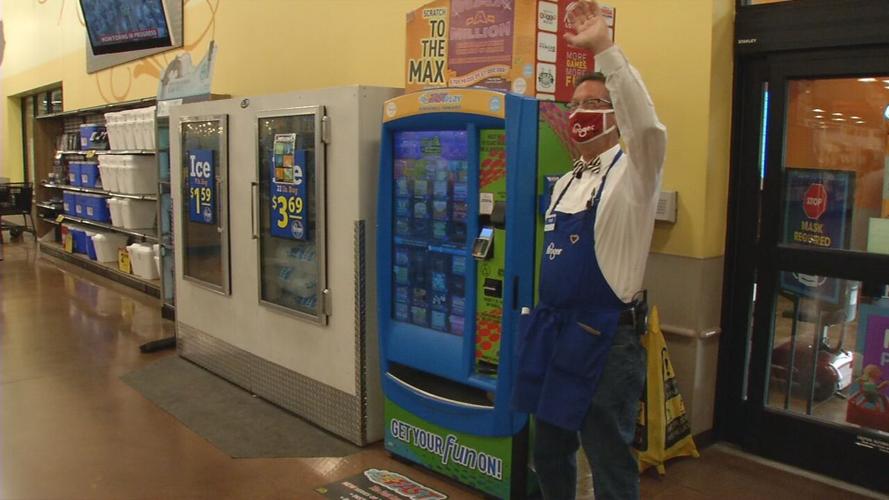 Terry Rush waves to fellow employees at Dixie Highway Kroger