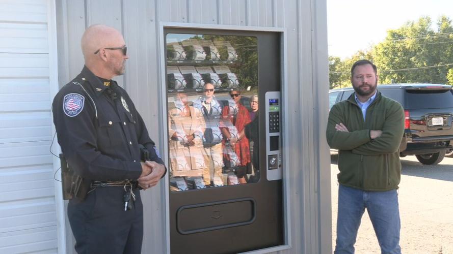 Vine Grove Police Chief Kenneth Mattingly near Narcan vending machine