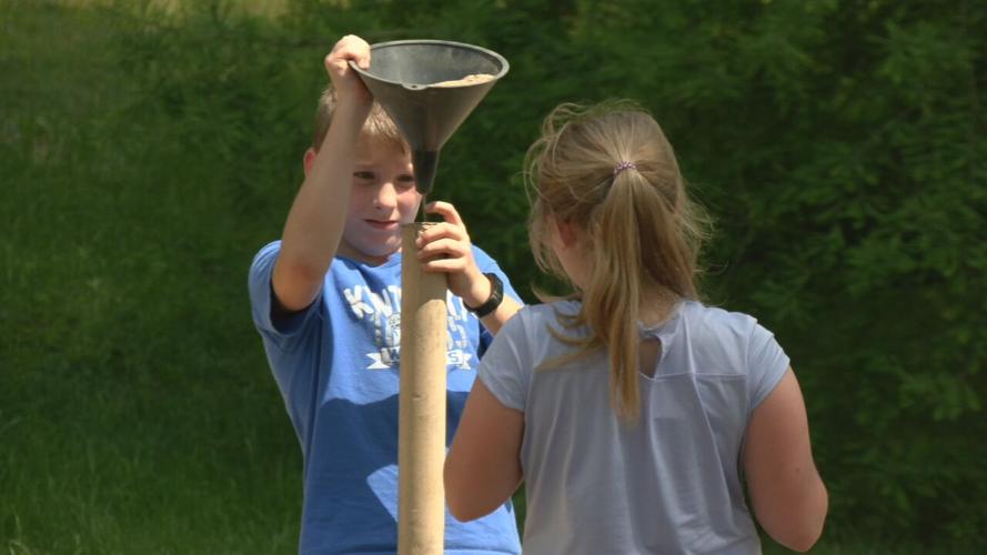 Children play at a playground at Bernheim Forest