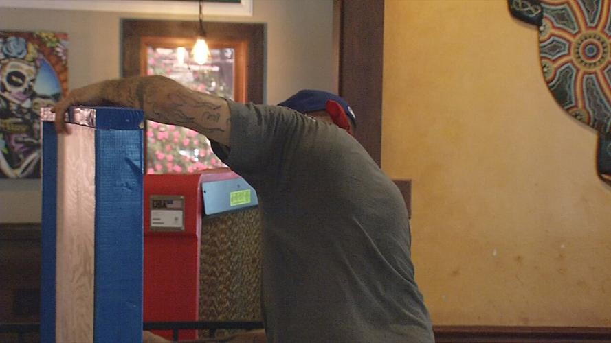 Indoor barrier being installed at Louisville restaurant