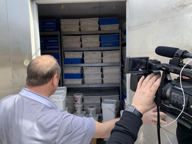 The Hungry Pelican's Al Feige shows off his refrigerator full of fish