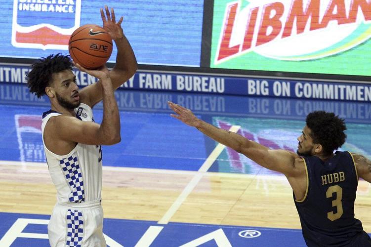 Kentucky's B.J. Boston, left, shoots
