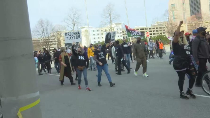 Protesters march through Louisville, Ky., on Saturday, March 13, 2021