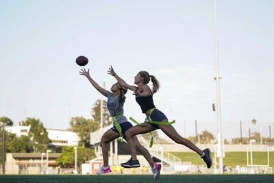 Girls play flag football