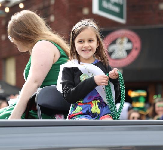 Girl hands out beads