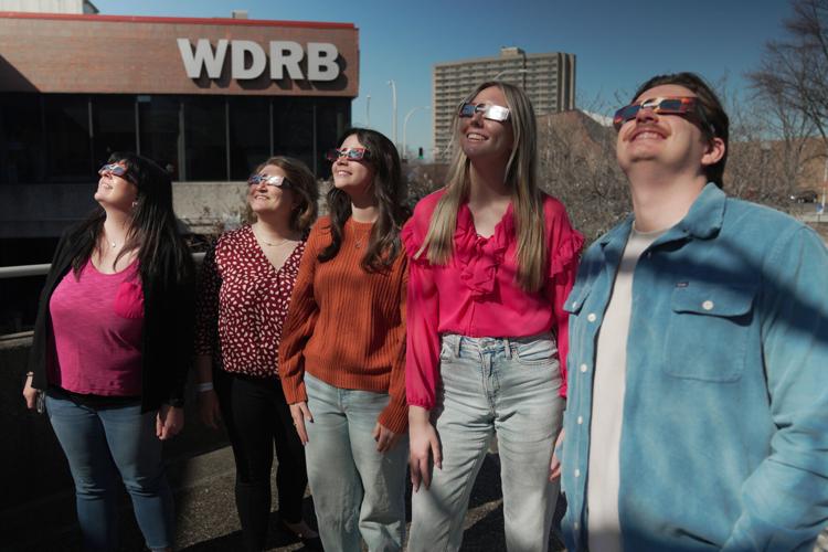 WDRB employees wear solar eclipse glasses