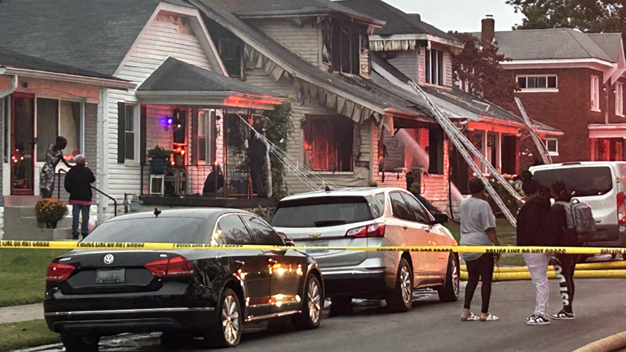 Crews battle house fire in west Louisville