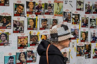 Pictures of Israeli hostages on bulletin board in Tel Aviv