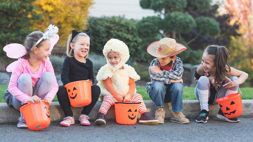 Trick or Treaters Sitting on Curb