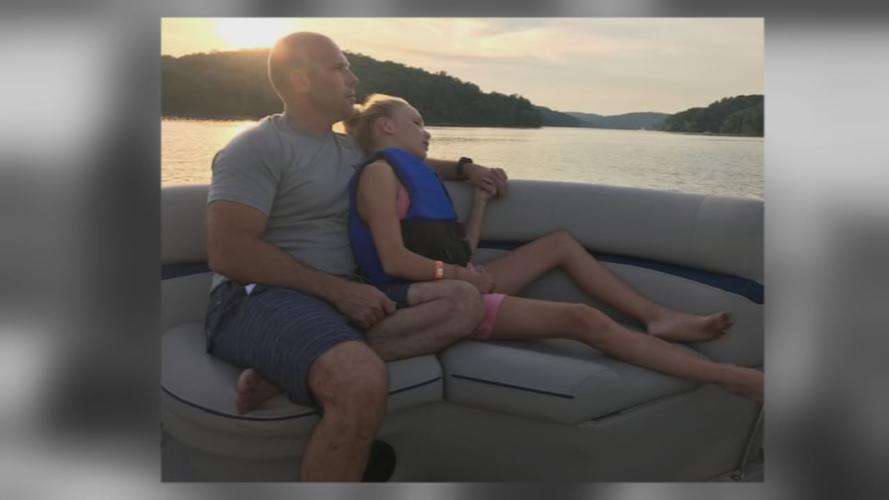 Travis Riley and his daughter