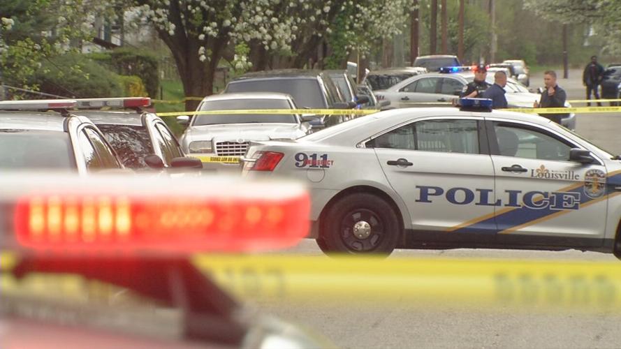 Louisville Metro Police officers respond to a shooting