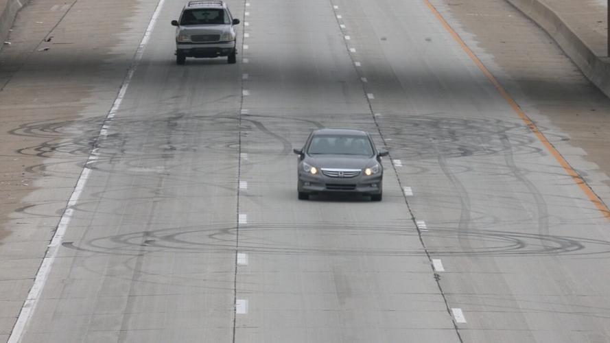 Black rubber tire marks on I-264 near Muhammad Ali International Airport