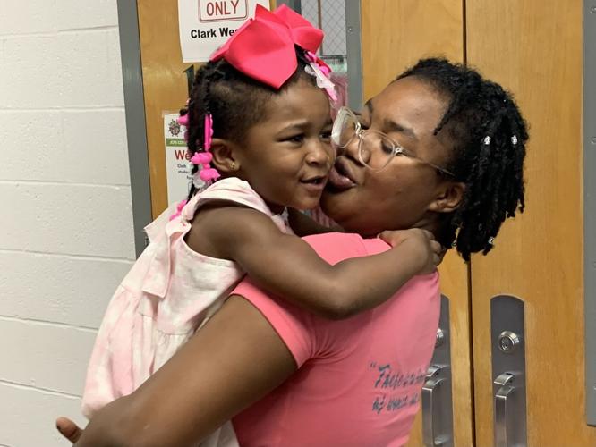 Skye Burris TAPP graduate holding daughter.jpg