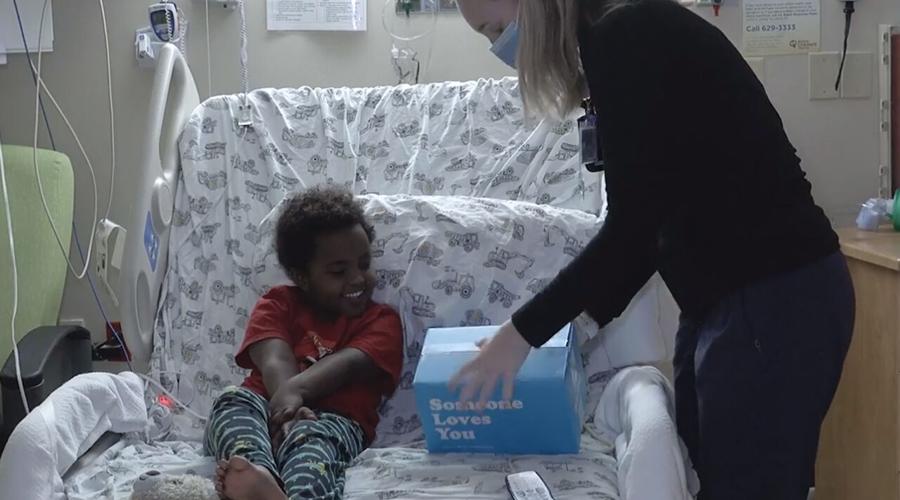 A Norton Healthcare child patient receives a Valentine's Day gift in 2022