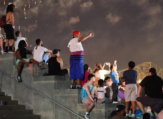 Man takes photo of fireworks at Thunder Over Louisville