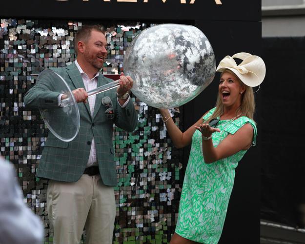 Wine glass held up at Churchill Downs.JPG