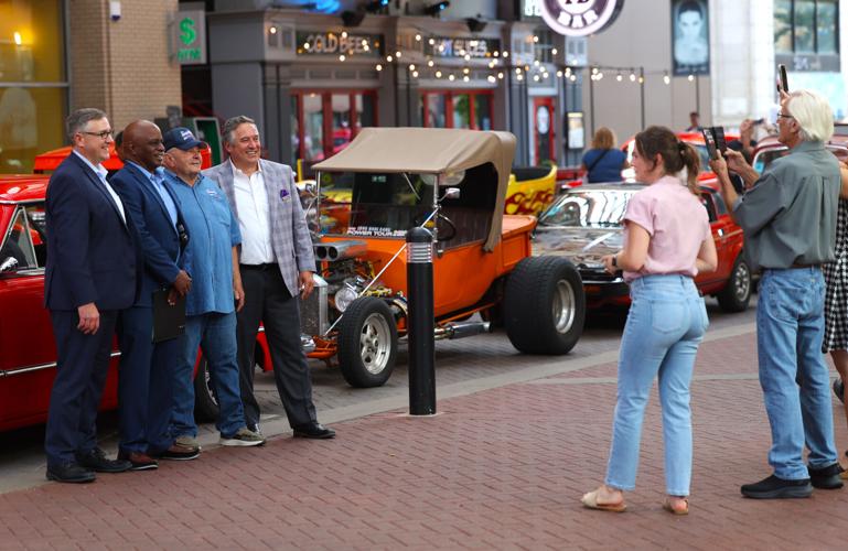 Group poses for photos at Street Rods.JPG