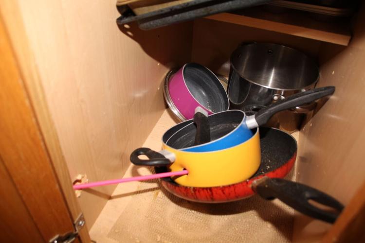 Bullet hole in pot inside Breonna Taylor's kitchen
